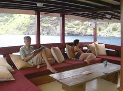 Sailing through Indonesian archipelago - relaxing on the boat