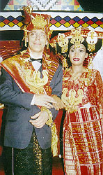 Heinz Kathmann and Rose Merry Ginting in traditional Batak Karo wedding dress